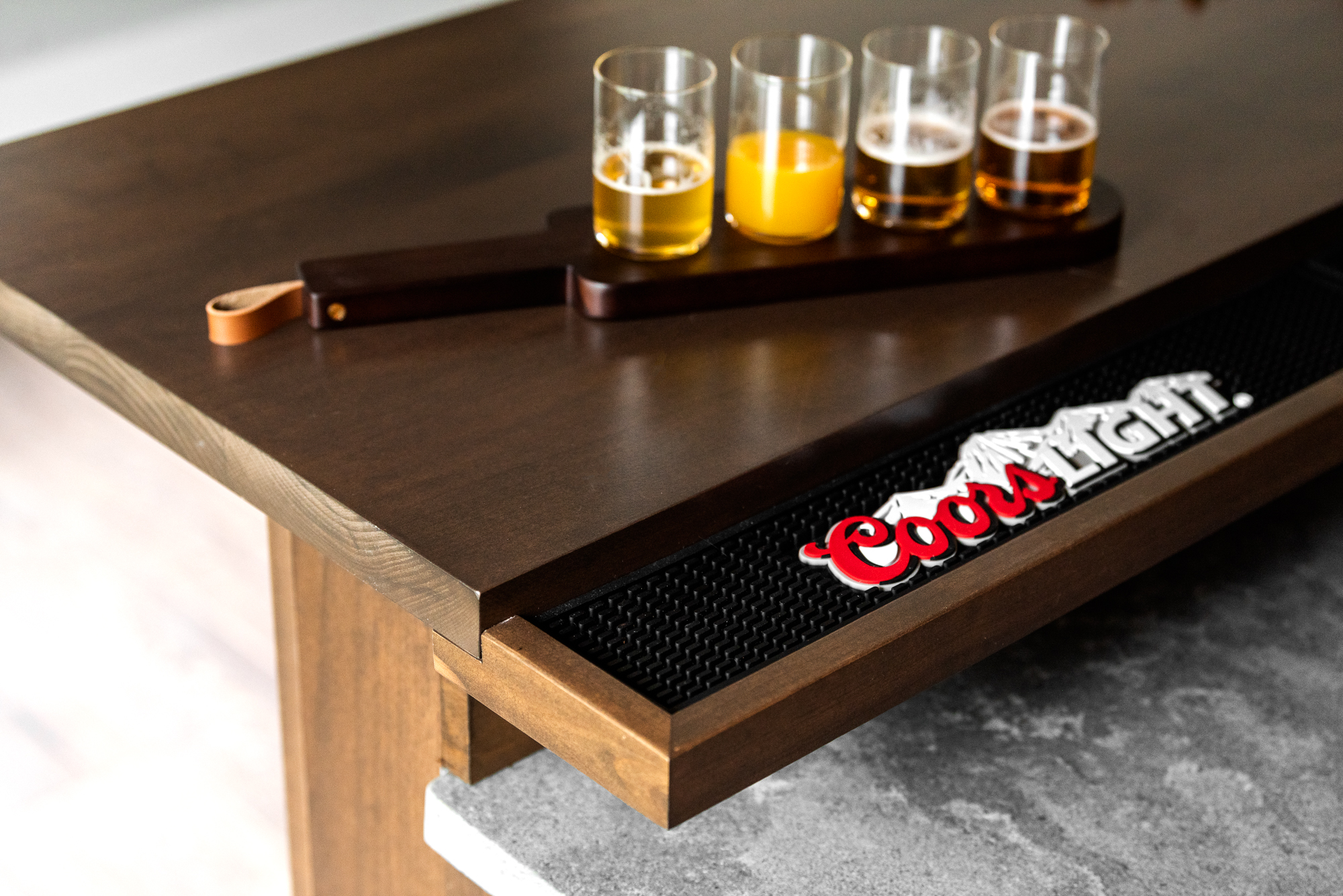 Masculine wood basement bar with game table. Designed by LC Interiors in Naperville, IL.
