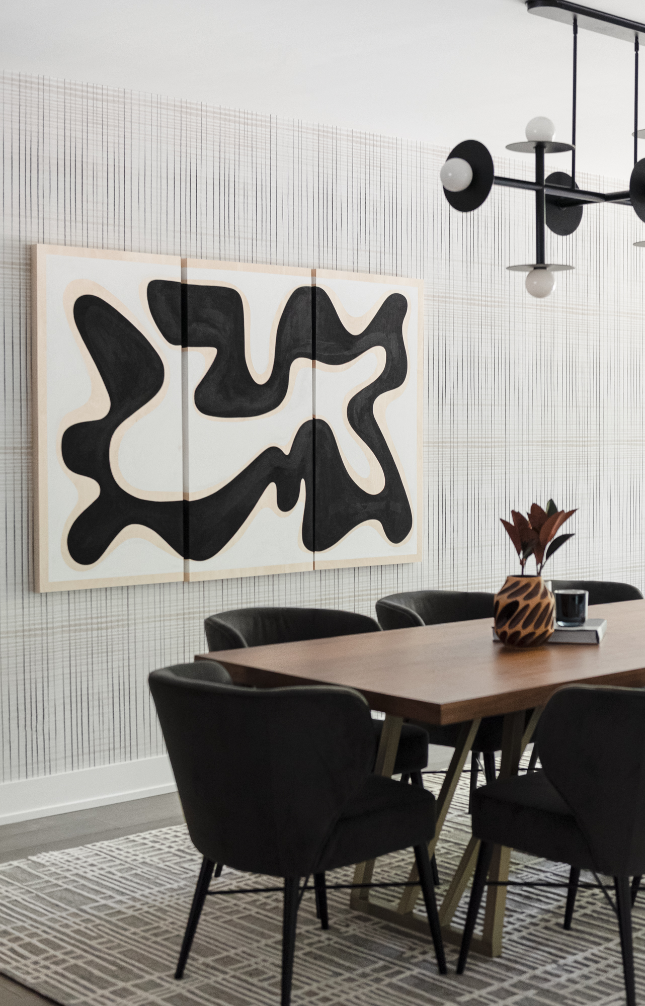 dining room with modern art and wallpaper