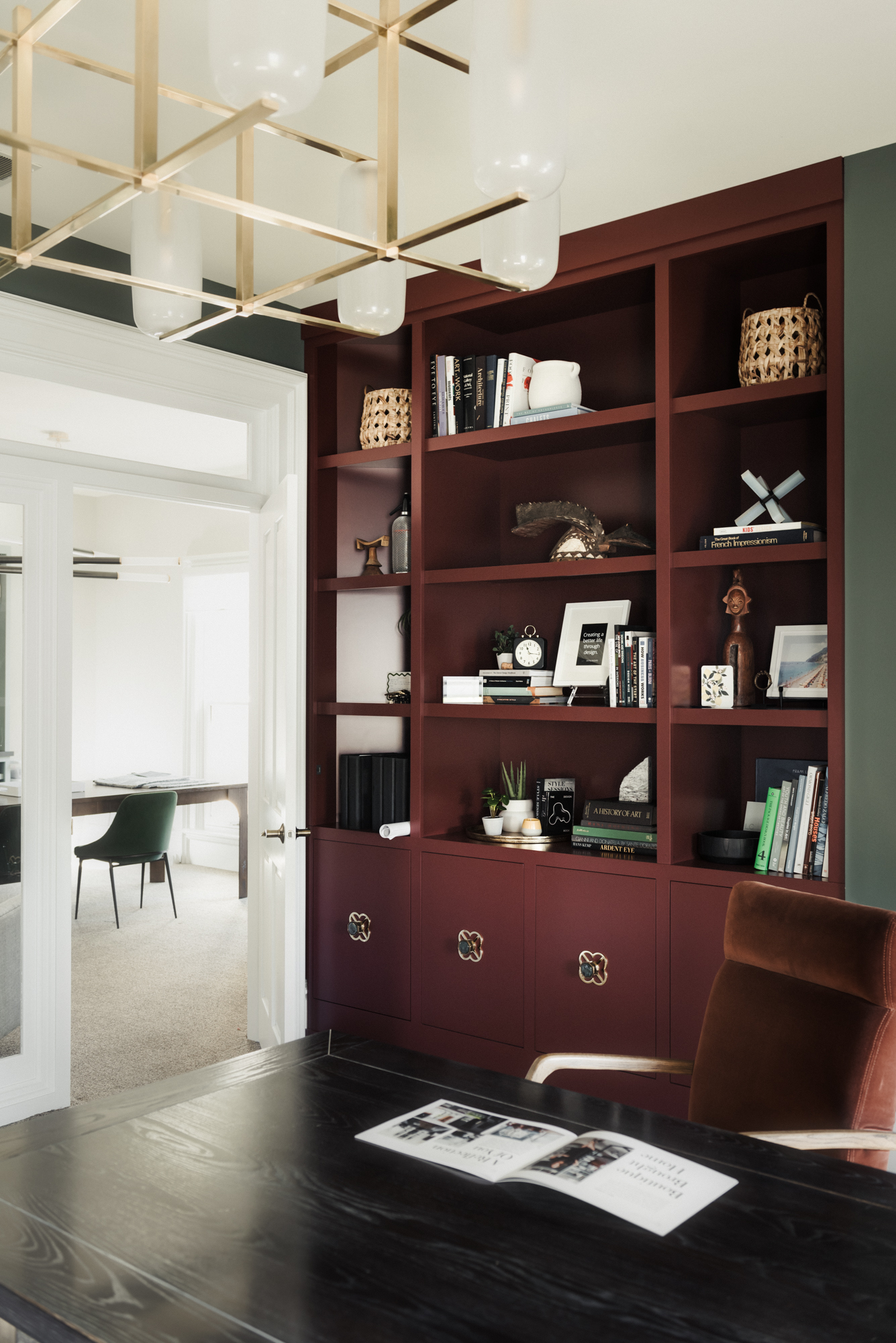 red builtins bookcase in office